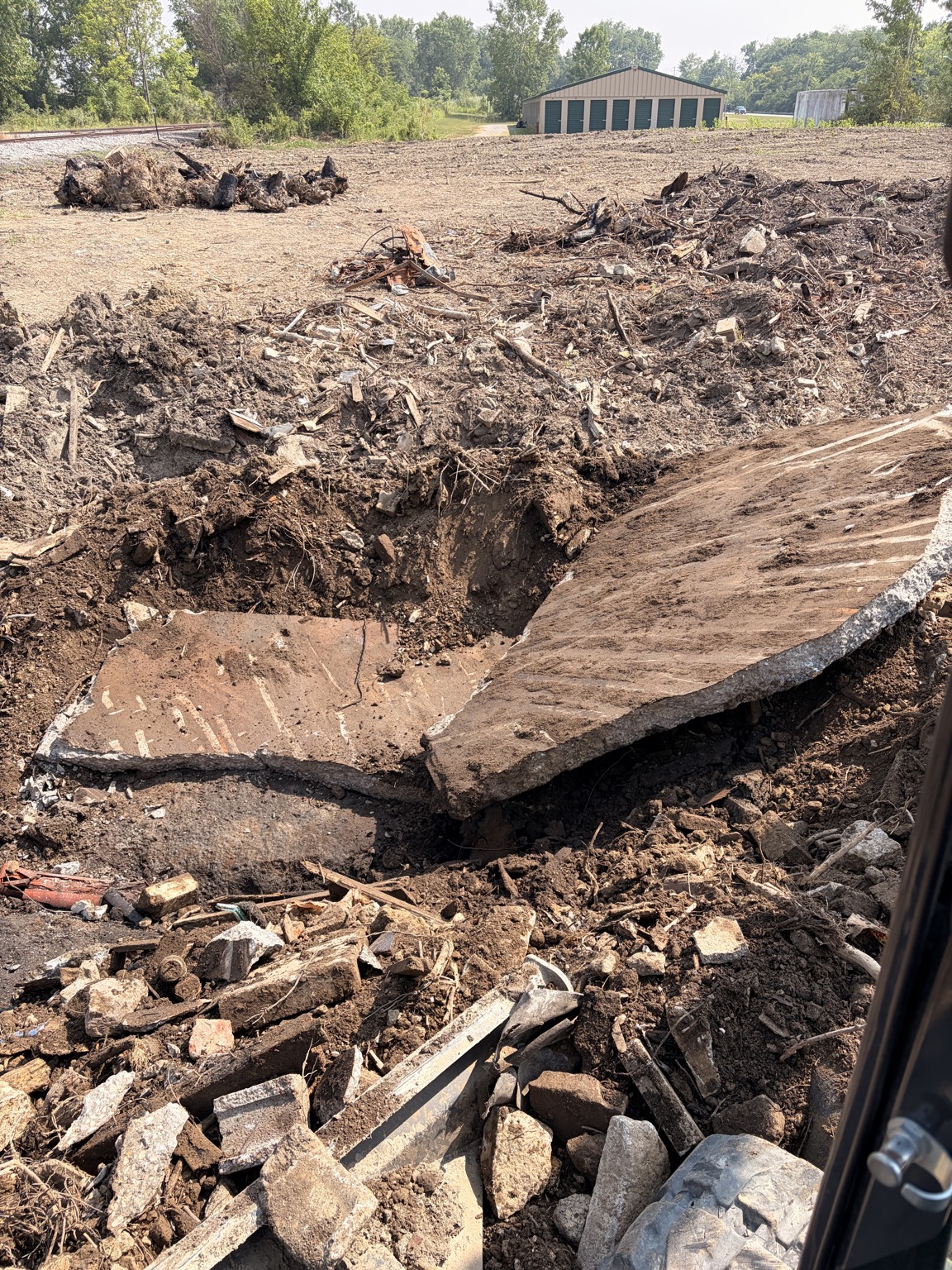 Concrete slab and debris removal during demolition site cleanup